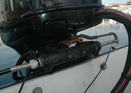 Steering attachment on an outboard